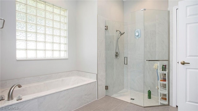 761 Grand Rapids Blvd, Naples, FL 34120 - full bathroom featuring a shower stall, a garden tub, and tile patterned floors