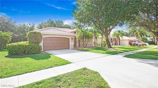 761 Grand Rapids Blvd, Naples, FL 34120 - mediterranean / spanish home with concrete driveway, a garage, stucco siding, a front yard, and a tiled roof