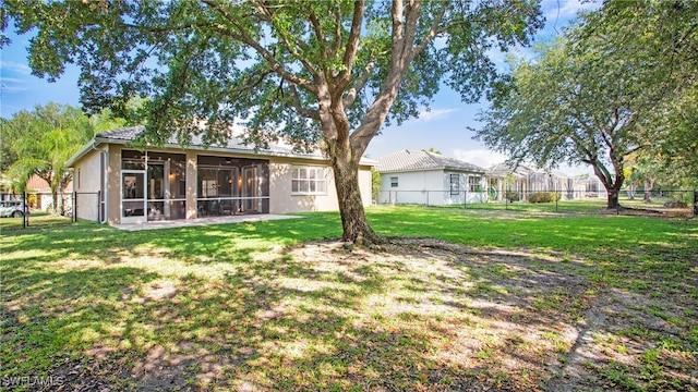 761 Grand Rapids Blvd, Naples, FL 34120 - back of house with a sunroom and stucco siding
