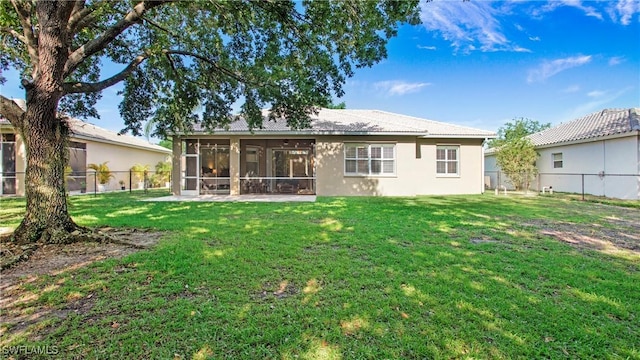 761 Grand Rapids Blvd, Naples, FL 34120 - rear view of house featuring a sunroom and stucco siding
