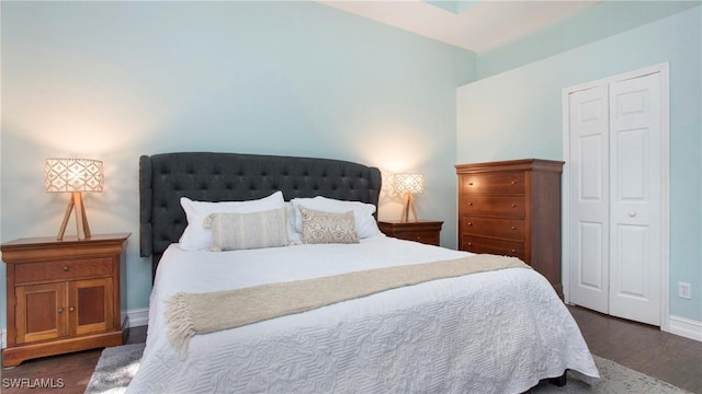 761 Grand Rapids Blvd, Naples, FL 34120 - bedroom featuring dark wood-style flooring, baseboards, and a closet