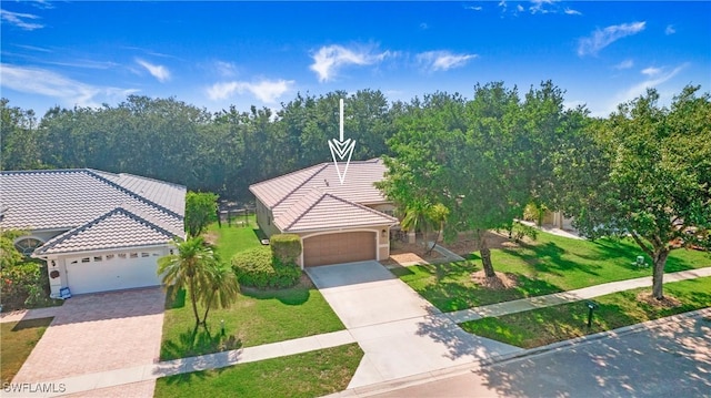 761 Grand Rapids Blvd, Naples, FL 34120 - view of front of house with driveway, a garage, a tiled roof, and a front lawn