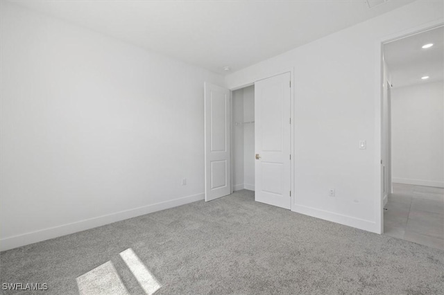 unfurnished bedroom with recessed lighting, carpet flooring, and baseboards
