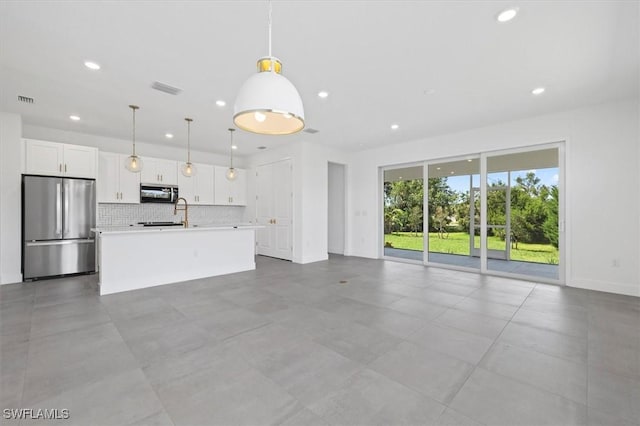 unfurnished living room with recessed lighting, visible vents, and baseboards