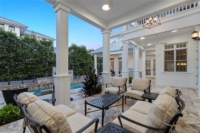 view of patio with an outdoor living space, ceiling fan, an outdoor pool, and french doors