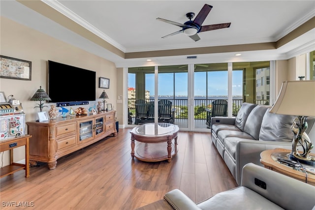 15140 Harbour Isle Dr Unit 502, Fort Myers, FL 33908 - living area with crown molding, a raised ceiling, ceiling fan, plenty of natural light, and recessed lighting