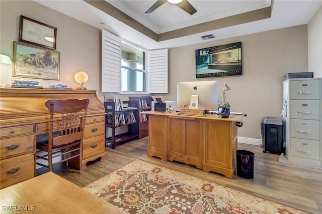 15140 Harbour Isle Dr Unit 502, Fort Myers, FL 33908 - office area featuring light wood-style floors, a tray ceiling, ceiling fan, crown molding, and baseboards