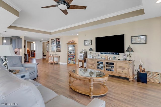 15140 Harbour Isle Dr Unit 502, Fort Myers, FL 33908 - living area with a tray ceiling, a ceiling fan, crown molding, light wood finished floors, and recessed lighting