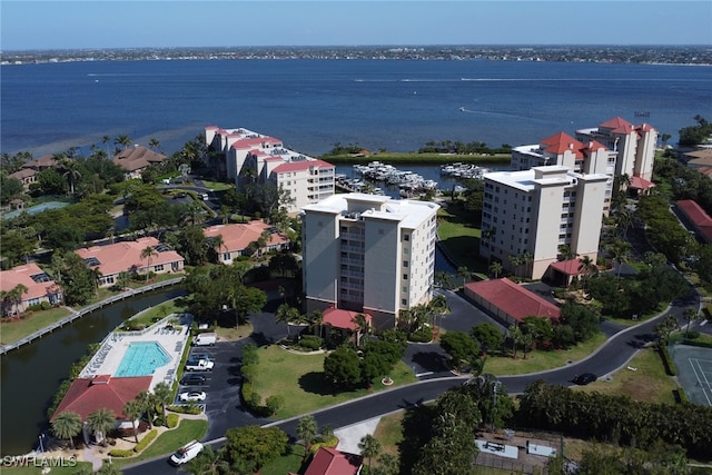 15140 Harbour Isle Dr Unit 502, Fort Myers, FL 33908 - drone / aerial view of a nearby body of water, apartment complex / building, and a pool area