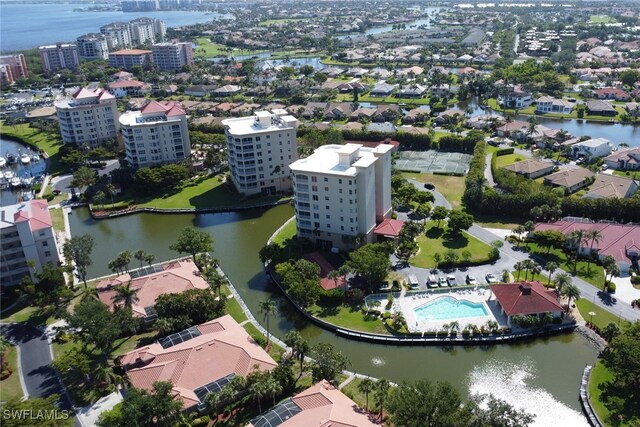 15140 Harbour Isle Dr Unit 502, Fort Myers, FL 33908 - bird's eye view of a nearby body of water, a pool area, and apartment complex