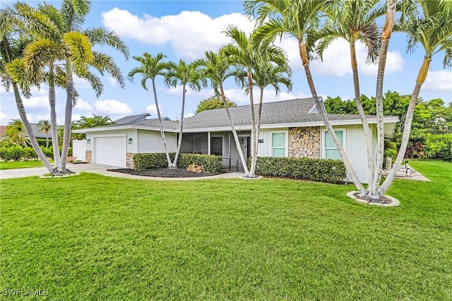 ranch-style home with a garage, stone siding, driveway, roof with shingles, and a front yard