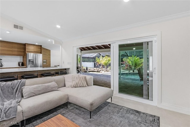 living area with ornamental molding, recessed lighting, and visible vents