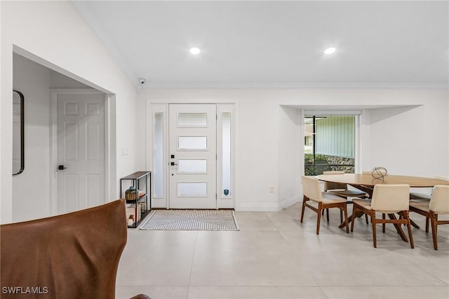 foyer featuring crown molding, recessed lighting, and baseboards