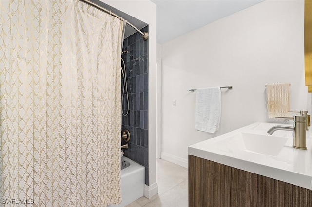 full bath with shower / bath combo, baseboards, tile patterned flooring, and a sink