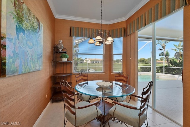 8789 Cedar Hammock Blvd Unit 61, Naples, FL 34112 - tiled dining room with healthy amount of natural light, ornamental molding, a chandelier, baseboards, and wallpapered walls