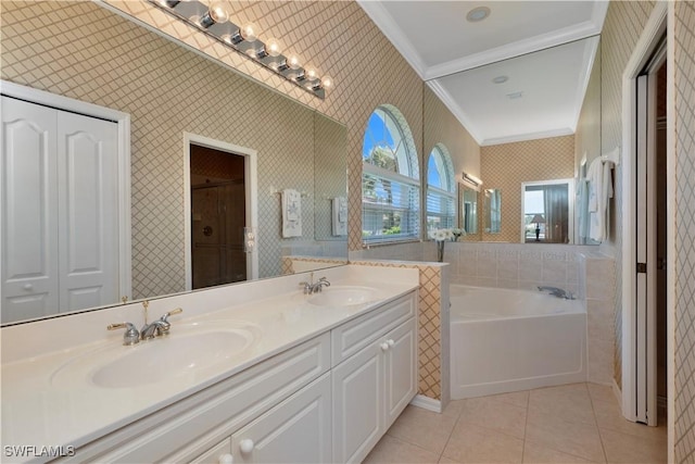 8789 Cedar Hammock Blvd Unit 61, Naples, FL 34112 - bathroom featuring ornamental molding, a garden tub, double vanity, wallpapered walls, and tile patterned flooring