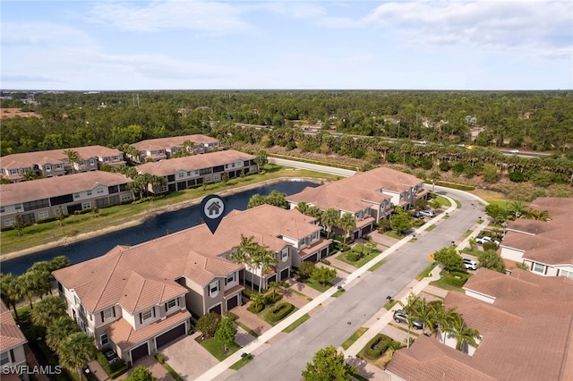 bird's eye view featuring a water view and a residential view