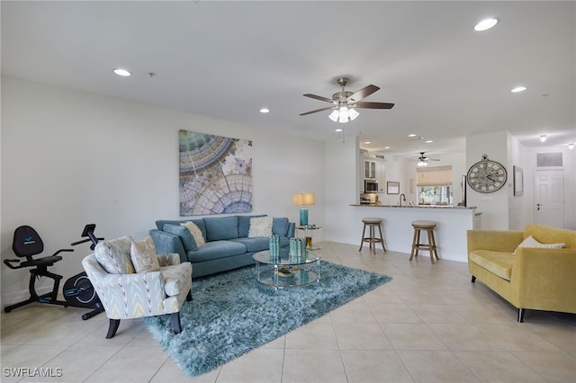 living area featuring recessed lighting, ceiling fan, and light tile patterned floors