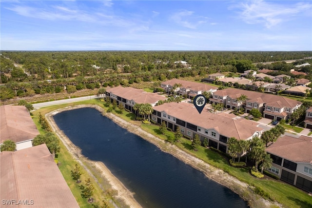 birds eye view of property featuring a water view and a residential view
