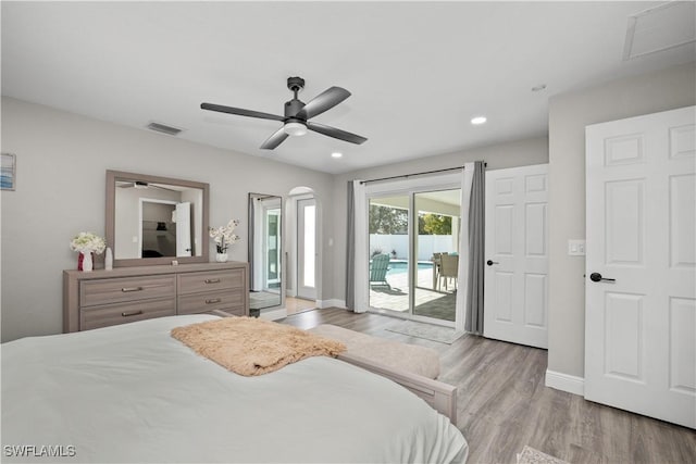 828 SW 51st Ter, Cape Coral, FL 33914 - bedroom featuring access to exterior, visible vents, and wood finished floors