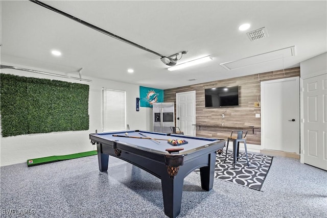 828 SW 51st Ter, Cape Coral, FL 33914 - playroom featuring attic access, recessed lighting, visible vents, wood walls, and speckled floor