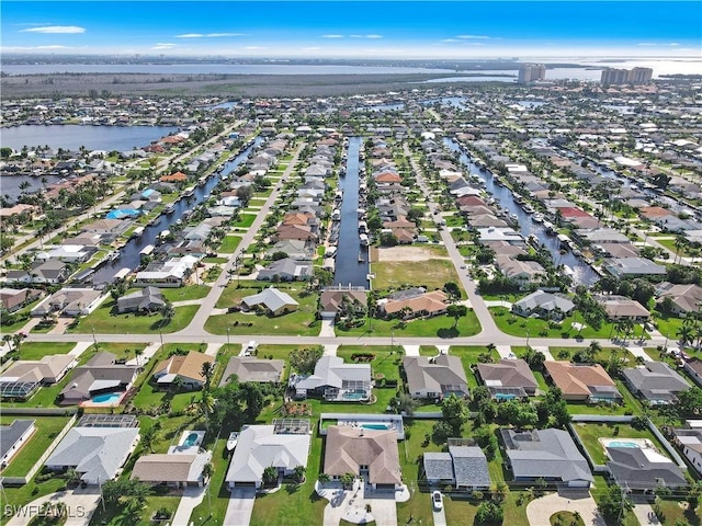828 SW 51st Ter, Cape Coral, FL 33914 - drone / aerial view featuring a water view and a residential view