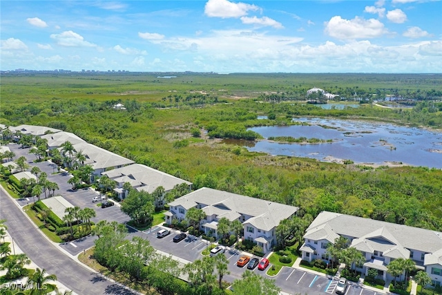 8355 Whisper Trace Way Unit K-103, Naples, FL 34114 - bird's eye view featuring a residential view, a water view, and a view of trees