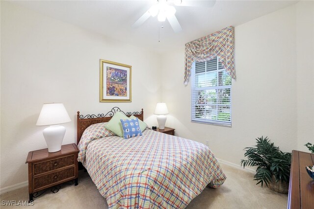 8355 Whisper Trace Way Unit K-103, Naples, FL 34114 - bedroom featuring baseboards, ceiling fan, and carpet floors