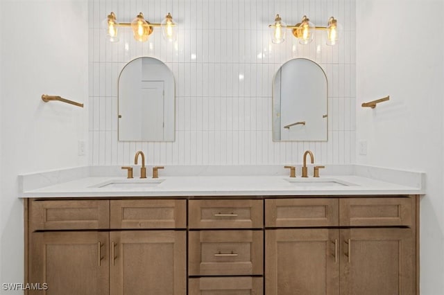 full bathroom featuring double vanity and a sink