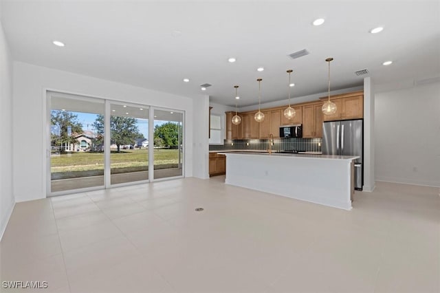 kitchen featuring decorative backsplash, appliances with stainless steel finishes, visible vents, recessed lighting, and brown cabinetry
