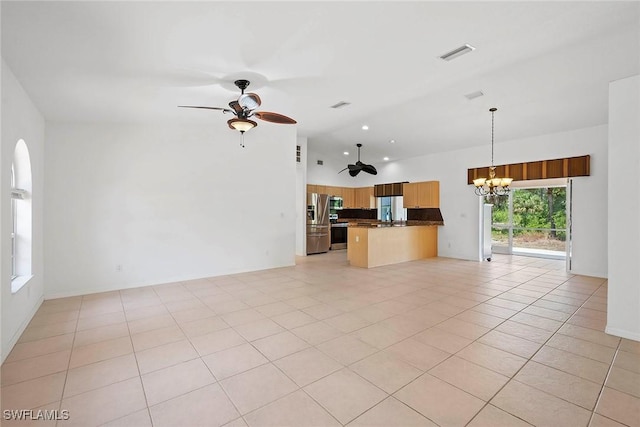 unfurnished living room with visible vents, light tile patterned floors, ceiling fan with notable chandelier, and high vaulted ceiling