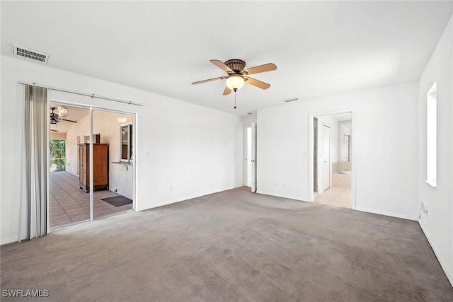 unfurnished bedroom with carpet, visible vents, access to exterior, and baseboards