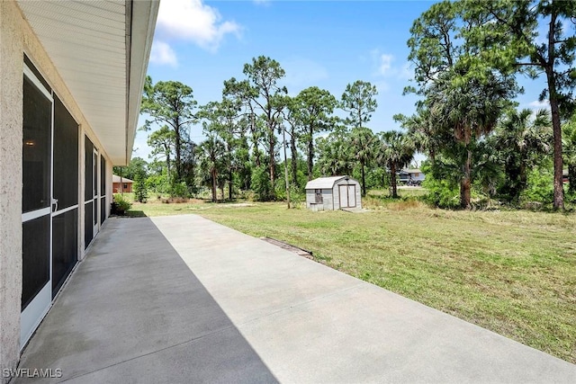 view of patio featuring a storage unit and an outdoor structure