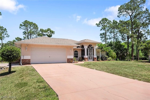 view of front of property with stucco siding, a front lawn, driveway, and an attached garage
