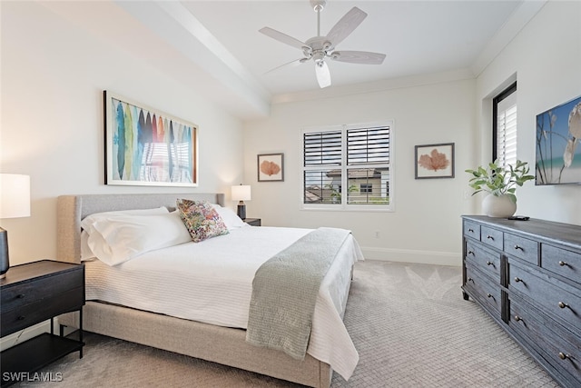 bedroom with baseboards, ornamental molding, a ceiling fan, and light colored carpet