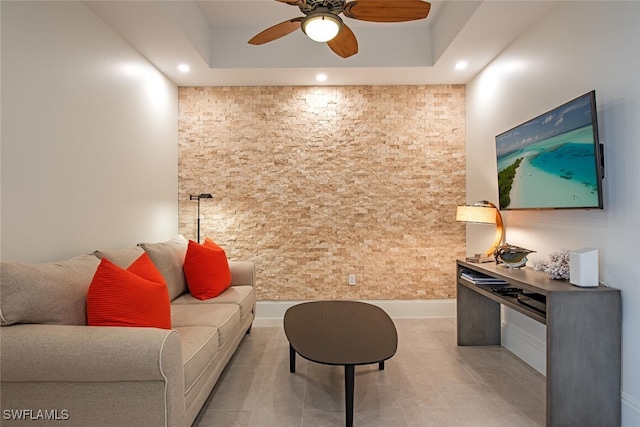 living room featuring light tile patterned flooring, a ceiling fan, and recessed lighting