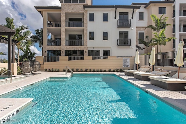 community pool featuring a patio area