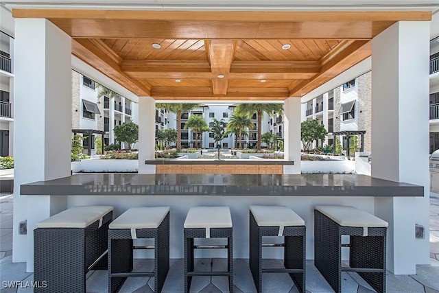 view of patio with outdoor dry bar
