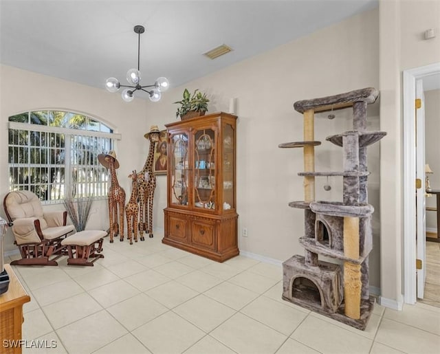 1103 SW 8th Ct, Cape Coral, FL 33991 - sitting room featuring baseboards, visible vents, light tile patterned floors, and a notable chandelier