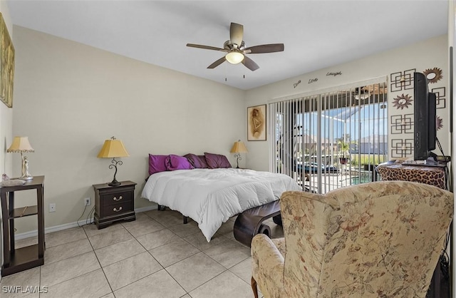 1103 SW 8th Ct, Cape Coral, FL 33991 - bedroom with light tile patterned floors, access to exterior, a ceiling fan, and baseboards