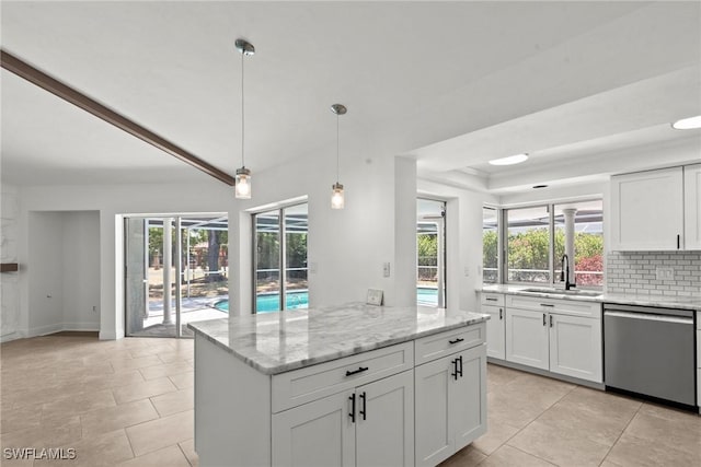 kitchen with a sink, a healthy amount of sunlight, white cabinetry, and dishwasher