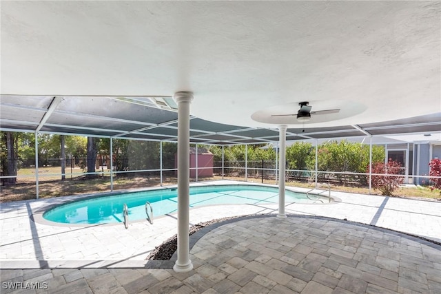 view of swimming pool with a fenced in pool, a patio area, and a lanai