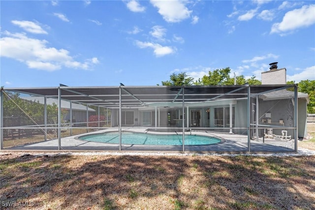 pool with a patio and a lanai