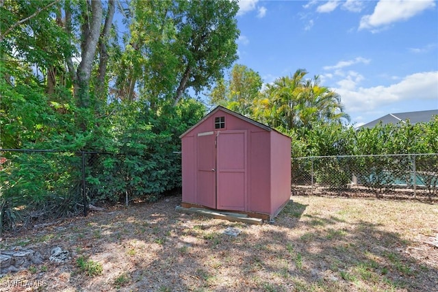 view of shed featuring a fenced backyard