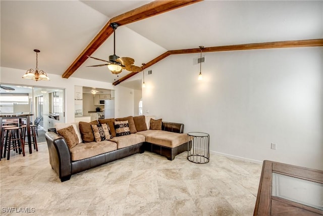 living area featuring a ceiling fan and baseboards
