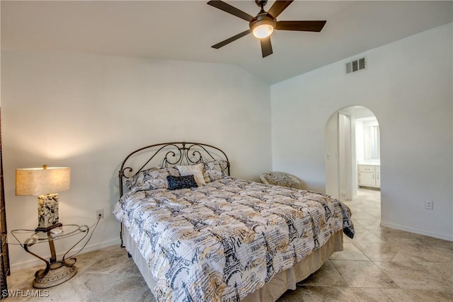 bedroom featuring arched walkways, lofted ceiling, light tile patterned floors, a ceiling fan, and baseboards