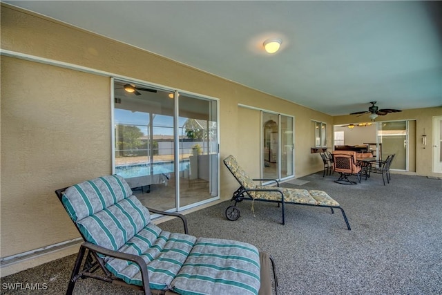 view of patio / terrace with a ceiling fan and outdoor dining area