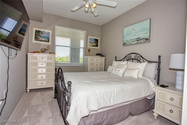 bedroom featuring carpet floors, baseboards, and ceiling fan
