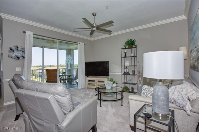 living room with crown molding, a ceiling fan, and carpet flooring