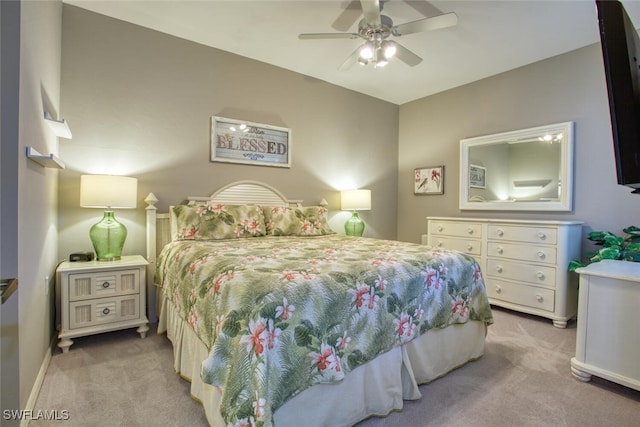 carpeted bedroom with baseboards and a ceiling fan